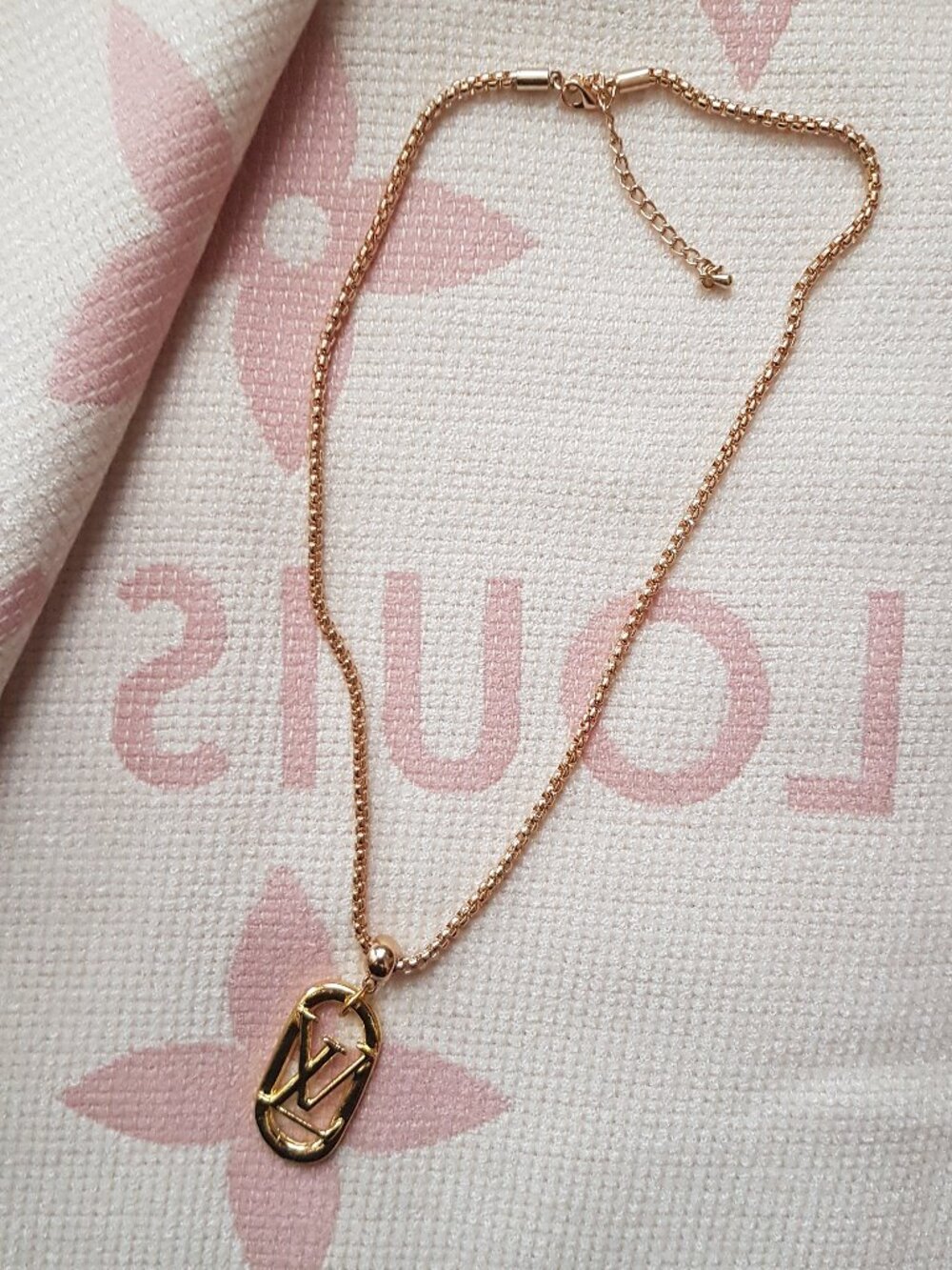 Gold  tone charm pendant with iconic initial